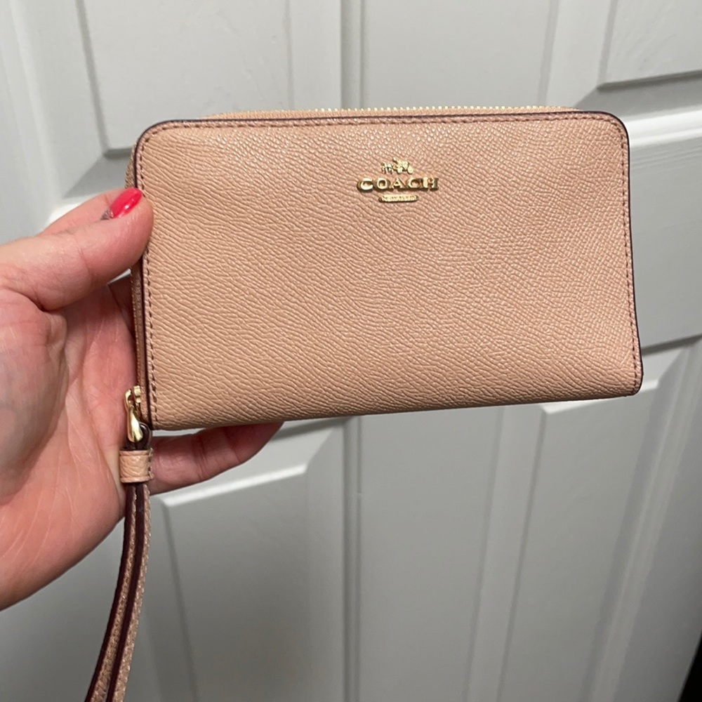 Light pink Coach wristlet